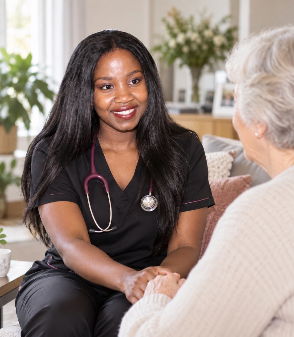 A registered nurse checking in with a client in their living room