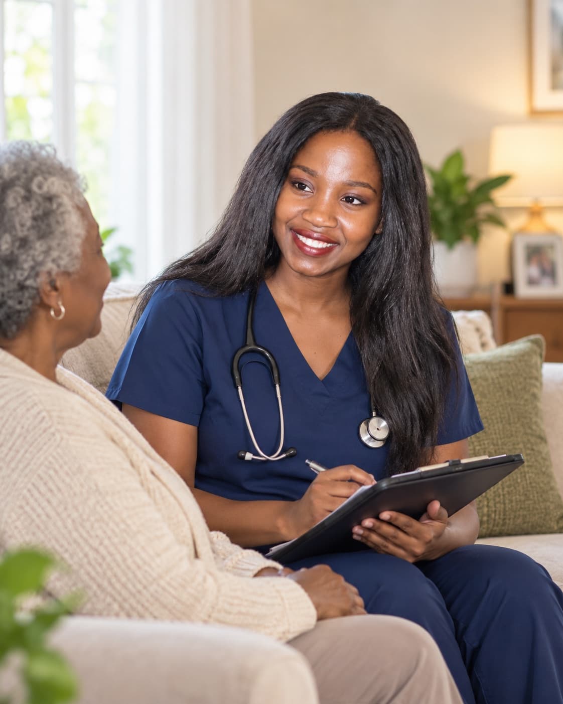 A nurse recording observations during a home visit
